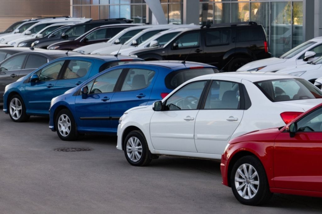 A row of cars for sale representing the UK car market