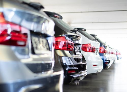 close up of cars parked in a line shown from rear